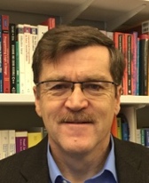 A person with a mustache and glasses

AI-generated content may be incorrect.
